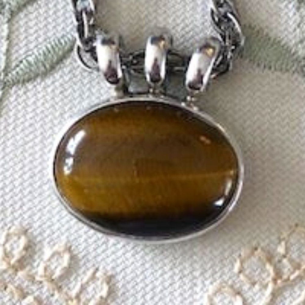 Large Oval Tiger Eye Shauntese Stone framed in 925 Silver